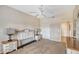 Bedroom with ceiling fan, dresser and nightstands at 4264 Central Sarasota Pkwy # 122, Sarasota, FL 34238