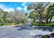 Gated entrance to community with lush landscaping at 4264 Central Sarasota Pkwy # 122, Sarasota, FL 34238