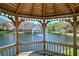 Gazebo view of pond with fountain and buildings at 4264 Central Sarasota Pkwy # 122, Sarasota, FL 34238