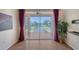 Living room with sliding doors leading to a balcony with water views at 4264 Central Sarasota Pkwy # 122, Sarasota, FL 34238