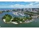 Aerial view of a marina, park, and cityscape at 4372 Woodmans Chart # 143, Sarasota, FL 34235