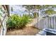 Small, private backyard with gravel ground cover and tropical plants at 4372 Woodmans Chart # 143, Sarasota, FL 34235