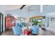 Bright and airy living room with high ceilings and comfortable seating at 4372 Woodmans Chart # 143, Sarasota, FL 34235