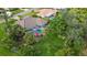 An aerial view showcasing a house with a pool and lush landscaping in a quiet neighborhood at 462 Rubens E Dr, Nokomis, FL 34275