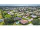 Aerial view showing a house with a pool in a neighborhood near the ocean at 462 Rubens E Dr, Nokomis, FL 34275