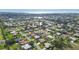 An aerial view showing a house with a pool in a quiet residential area near the ocean at 462 Rubens E Dr, Nokomis, FL 34275