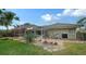 Landscaped backyard with pool and screened enclosure at 462 Rubens E Dr, Nokomis, FL 34275