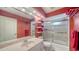 Bathroom with single vanity, tub shower combo and red walls at 462 Rubens E Dr, Nokomis, FL 34275