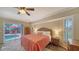 Relaxing bedroom with king-size bed, access to the pool, and wood-look floors at 462 Rubens E Dr, Nokomis, FL 34275