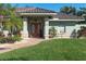 House entrance with double doors, tile roof and walkway at 462 Rubens E Dr, Nokomis, FL 34275