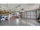 Spacious garage with ample storage and overhead door at 462 Rubens E Dr, Nokomis, FL 34275