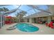 Inviting pool and spa with covered lanai and seating at 462 Rubens E Dr, Nokomis, FL 34275