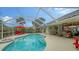 Inviting pool area with covered lanai, spa, and comfortable seating at 462 Rubens E Dr, Nokomis, FL 34275