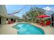 Screened pool and spa with comfortable lounge chairs at 462 Rubens E Dr, Nokomis, FL 34275