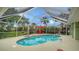 Relaxing screened-in pool and spa with comfortable seating at 462 Rubens E Dr, Nokomis, FL 34275