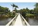 Picturesque bridge over a canal with lush greenery at 4717 Winslow Beacon # 7, Sarasota, FL 34235