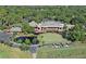 Aerial view of clubhouse with pond and putting green at 4717 Winslow Beacon # 7, Sarasota, FL 34235