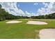 Golf course view with green fairways and sand traps at 4717 Winslow Beacon # 7, Sarasota, FL 34235