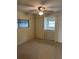 Bedroom with ceiling fan, window, and built-in dresser at 510 50Th Avenue W Dr, Bradenton, FL 34207