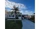 Single-story home with carport and palm tree at 510 50Th Avenue W Dr, Bradenton, FL 34207