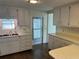 Bright kitchen with ample cabinetry and access to outside at 510 50Th Avenue W Dr, Bradenton, FL 34207