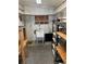 Spacious workshop with shelving and utility sink at 510 50Th Avenue W Dr, Bradenton, FL 34207