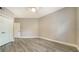 Spacious bedroom with wood-look floors and a closet at 5180 Northridge Rd # 101, Sarasota, FL 34238