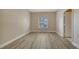 Well-lit bedroom featuring wood-look floors at 5180 Northridge Rd # 101, Sarasota, FL 34238