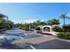 Entrance to the Serenades community with lush landscaping and a welcoming atmosphere at 5180 Northridge Rd # 101, Sarasota, FL 34238