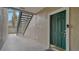 Building entryway with green door and stairway at 5180 Northridge Rd # 101, Sarasota, FL 34238