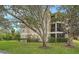 Two-story building with lush landscaping and ample parking at 5180 Northridge Rd # 101, Sarasota, FL 34238