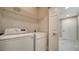 Laundry room with LG washer and dryer and overhead shelving at 5180 Northridge Rd # 101, Sarasota, FL 34238