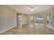 Living room with hardwood floors and sliding glass doors at 5180 Northridge Rd # 101, Sarasota, FL 34238