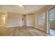 Living room with hardwood floors and access to a balcony at 5180 Northridge Rd # 101, Sarasota, FL 34238