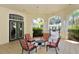 Relaxing outdoor patio area with comfortable seating and views of the pool at 5180 Northridge Rd # 101, Sarasota, FL 34238