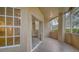 Spacious screened balcony with tile flooring and access to the outdoors at 5180 Northridge Rd # 101, Sarasota, FL 34238