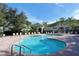 Resort-style swimming pool with plenty of lounge chairs at 5180 Northridge Rd # 101, Sarasota, FL 34238