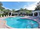 Community pool with a relaxing atmosphere and surrounding patio at 5180 Northridge Rd # 101, Sarasota, FL 34238