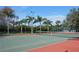 Well-maintained tennis court with surrounding greenery at 5180 Northridge Rd # 101, Sarasota, FL 34238