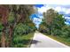 Paved Legacy Trail path through a natural, wooded area at 5180 Northridge Rd # 101, Sarasota, FL 34238