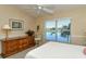 Bedroom with lake view and ceiling fan at 5251 Mahogany Run Ave # 524, Sarasota, FL 34241