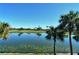 Serene lake view with palm trees and reflection of golf course at 5251 Mahogany Run Ave # 524, Sarasota, FL 34241