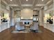 Elegant clubhouse lobby with fireplace and seating area at 5251 Mahogany Run Ave # 524, Sarasota, FL 34241