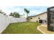 Spacious backyard with grassy area and fence at 5425 Skyline Pl, Sarasota, FL 34232