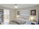 Bedroom with queen bed, ensuite bathroom access, and view of pool at 5425 Skyline Pl, Sarasota, FL 34232