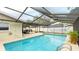 Refreshing screened pool perfect for relaxation at 5425 Skyline Pl, Sarasota, FL 34232