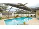 Inviting screened pool with paved deck at 5425 Skyline Pl, Sarasota, FL 34232