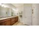 Double vanity bathroom with granite countertops and large mirror at 5552 Eagle Creek Rd, Sarasota, FL 34238