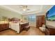 Spacious main bedroom with wood flooring, large walk-in closet and ceiling fan at 5552 Eagle Creek Rd, Sarasota, FL 34238