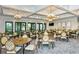 Bright dining room featuring ample seating and elegant chandeliers at 5552 Eagle Creek Rd, Sarasota, FL 34238